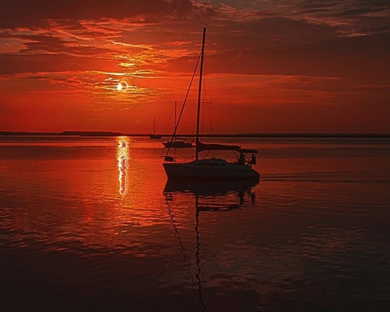 sailboat at sunrise